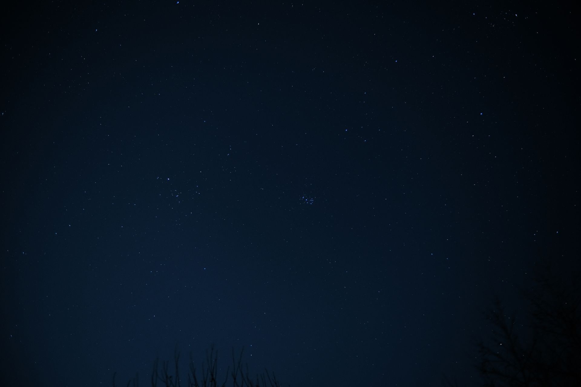 Constellations of stars across a dark night sky