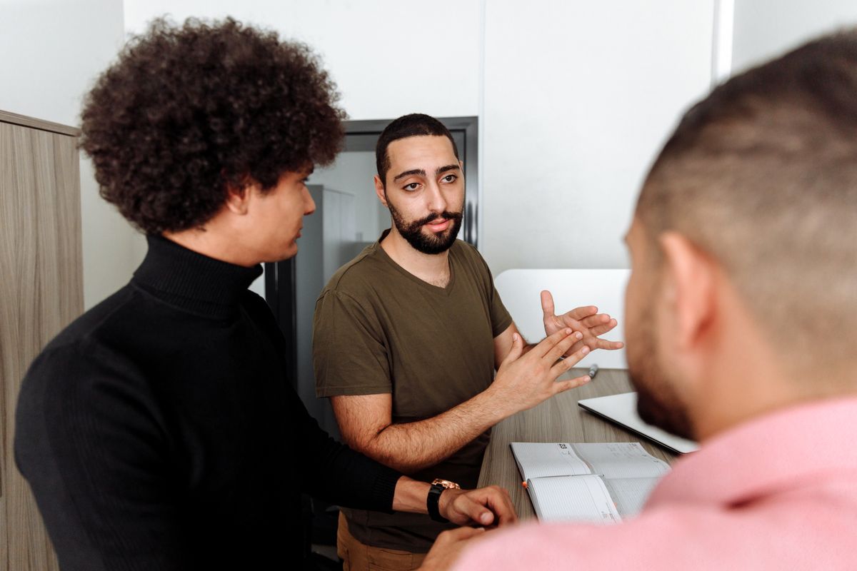 Colleagues in a thoughtful discussion in a modern office