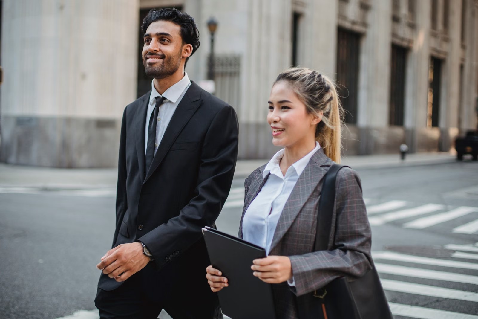 Business professionals walking through a moving city