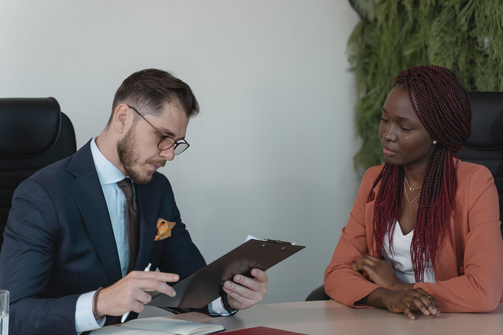 Two professionals in a warm welcome conversation