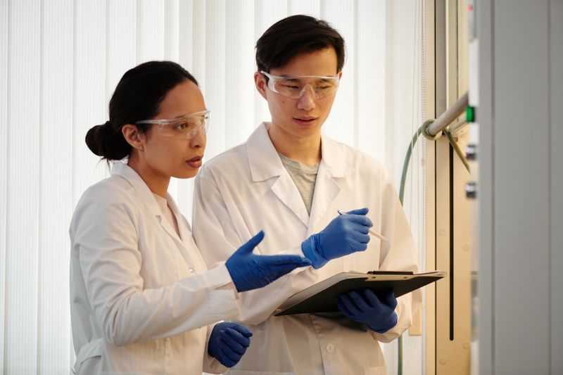 Researchers discussing data in a laboratory