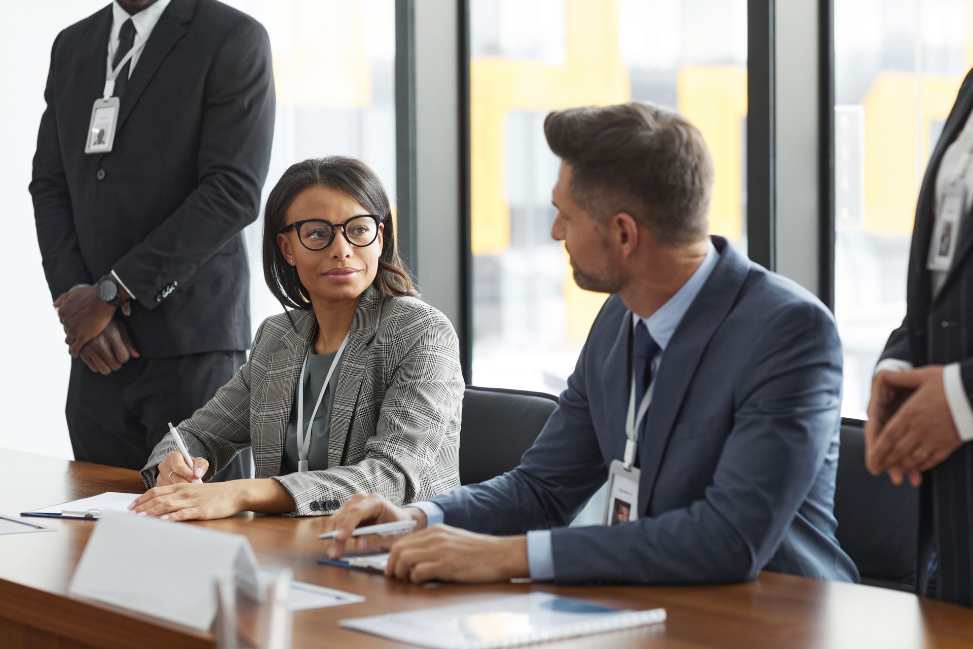 Business professionals discussing strategy in a modern board meeting