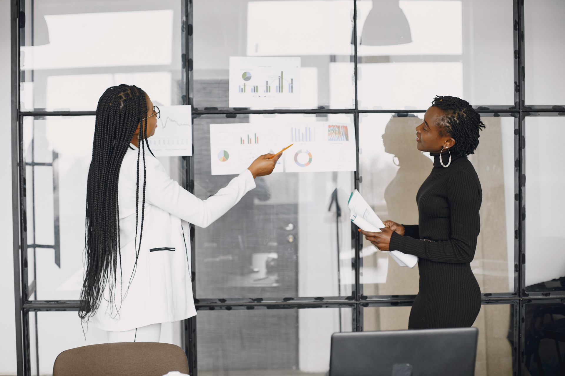 Two professionals reviewing results together in an office