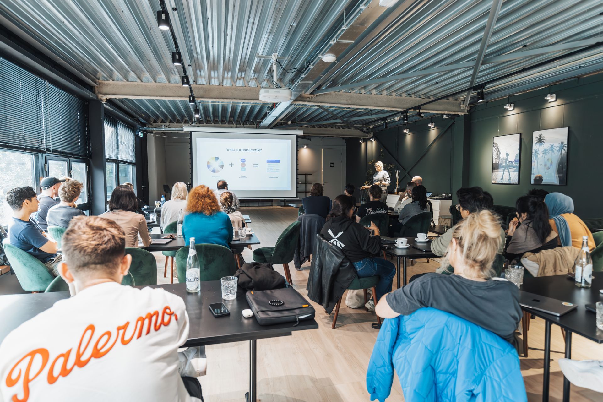 A diverse group attending an educational workshop indoors