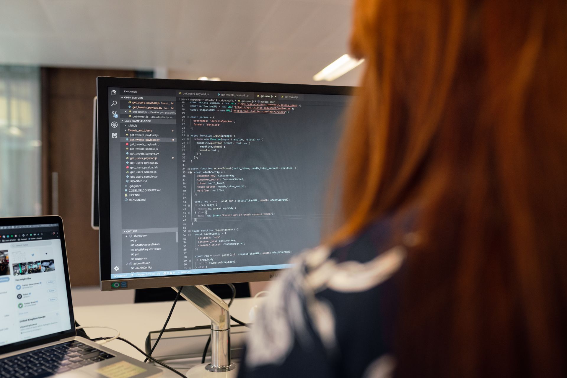 A female engineer working through code at her workstation