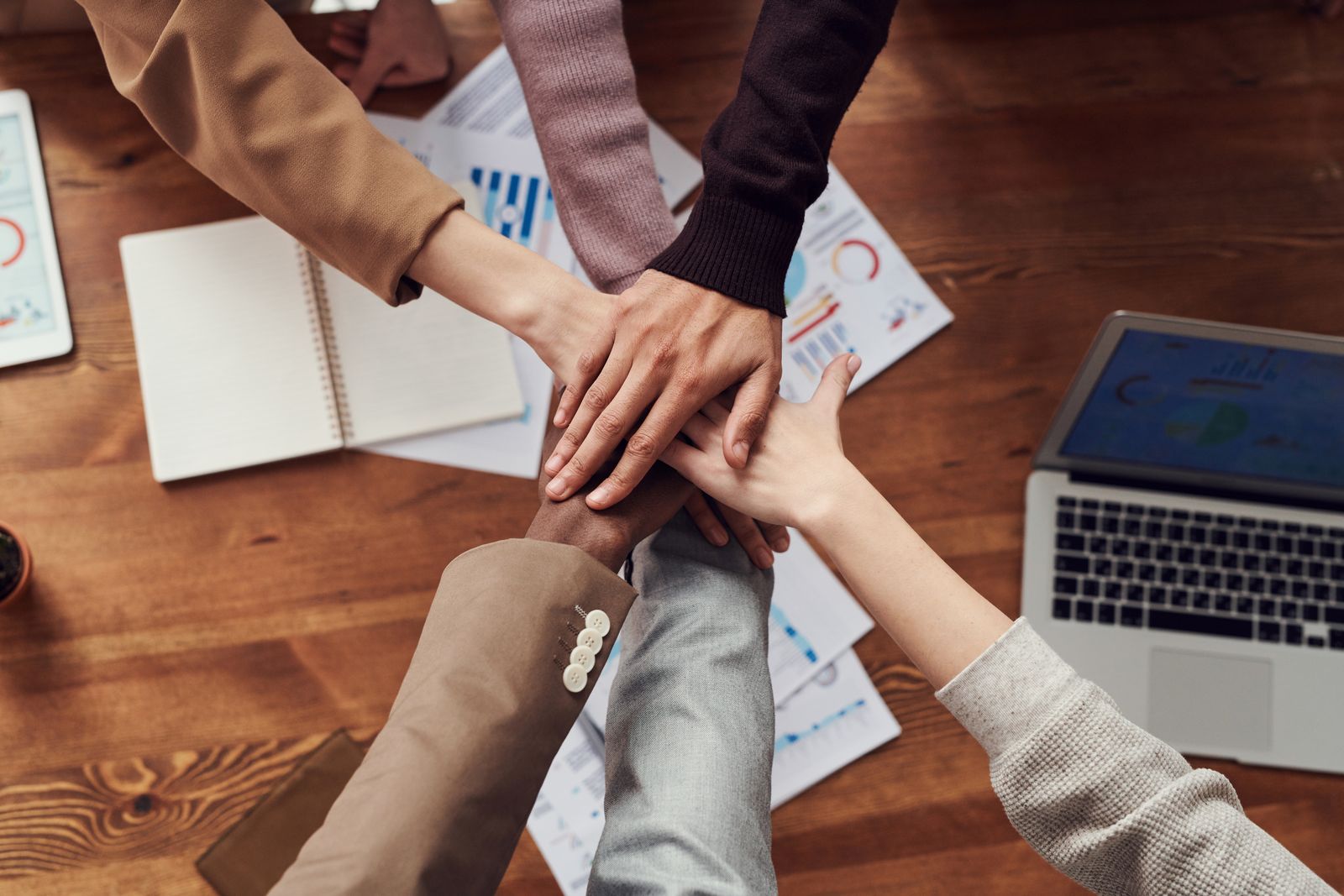 A learning community joining hands over their work