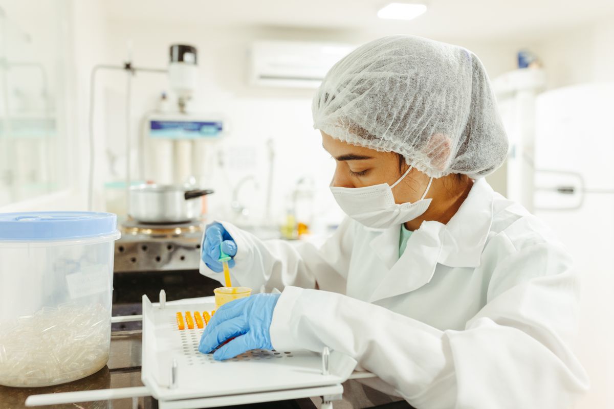 A scientist performing a meticulous experiment in a laboratory