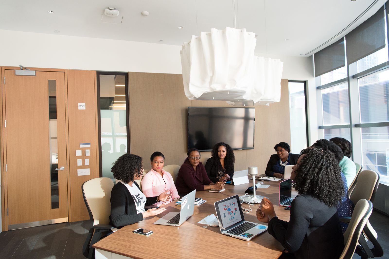 A leadership team reviewing analysis in a boardroom